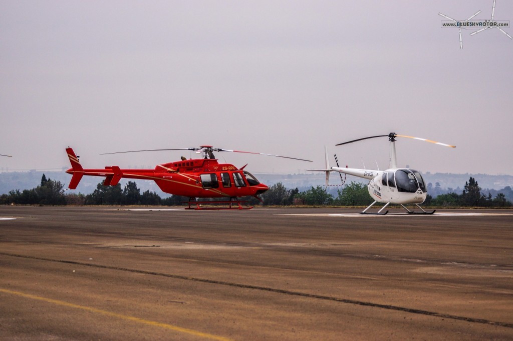 Bell 407 and R44 at FAGC airport, Gauteng province, South Africa