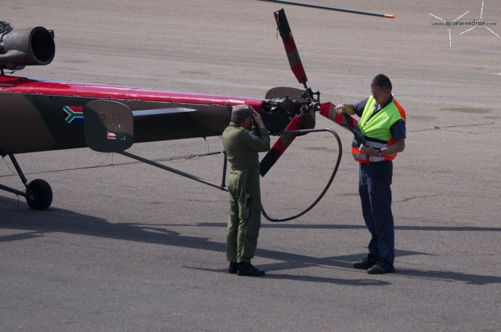 Alouette III after flight inspection with a pilot getting pretty