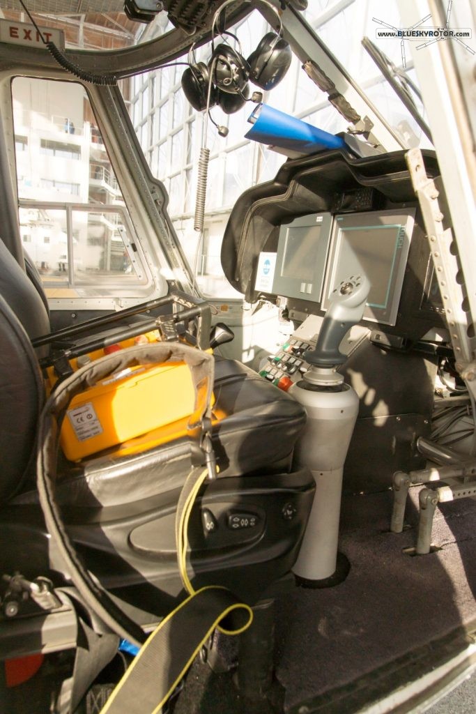 BK117 cockpit: the pilots flies with the sticks and operates the crane